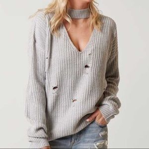 Distressed key hole sweater
